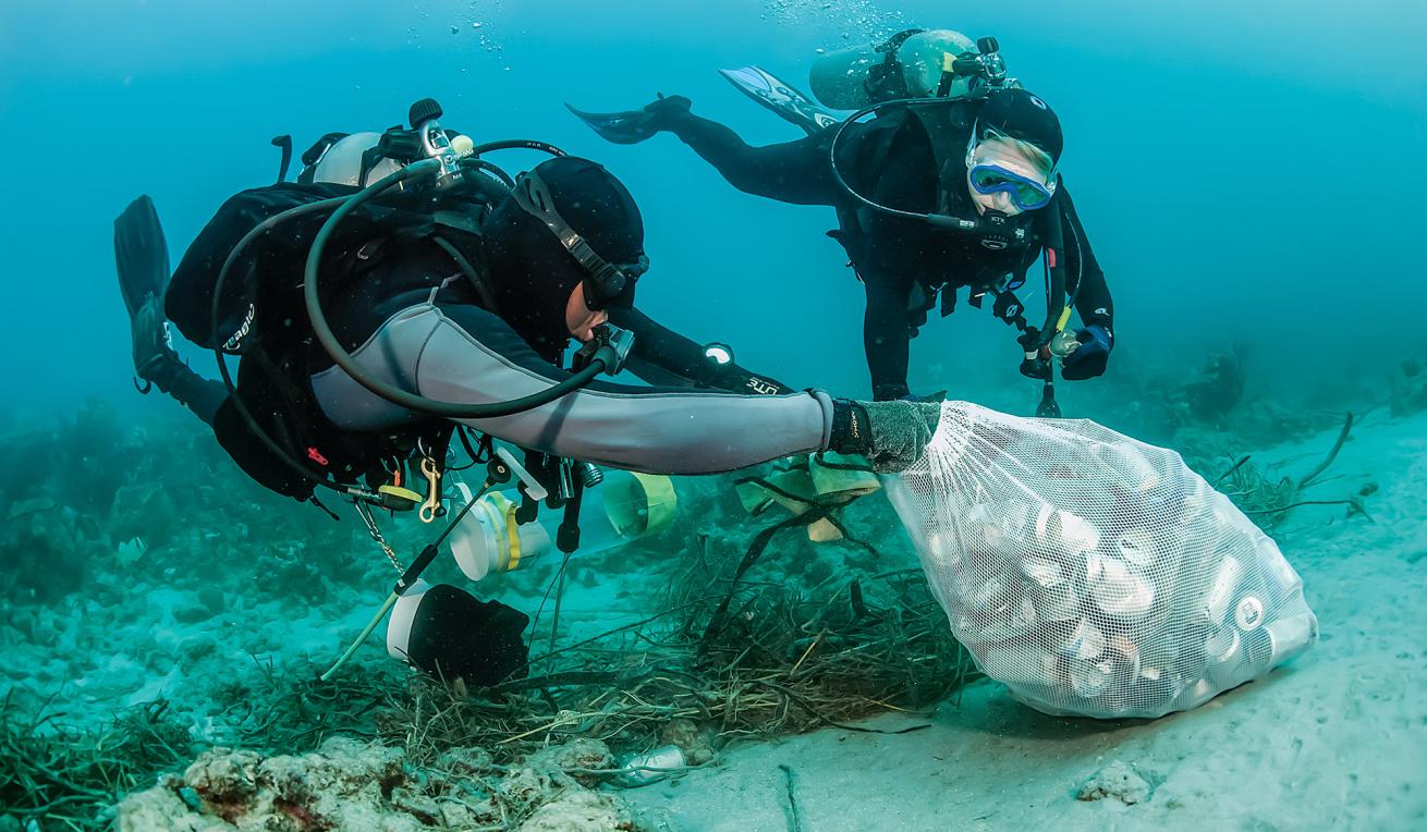 Diver cleaning trash from ocean